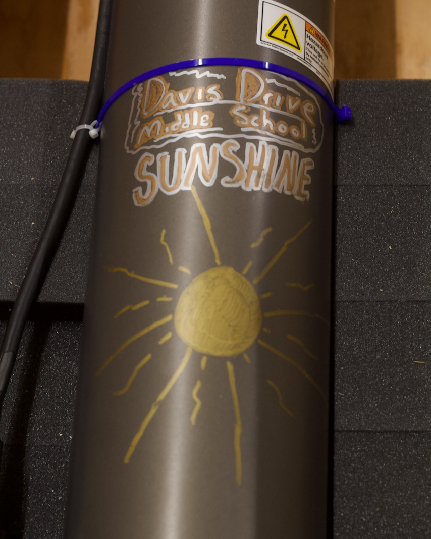 Close-up of WHOI decoration of float Sunshine.